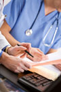 Doctors reading medical files