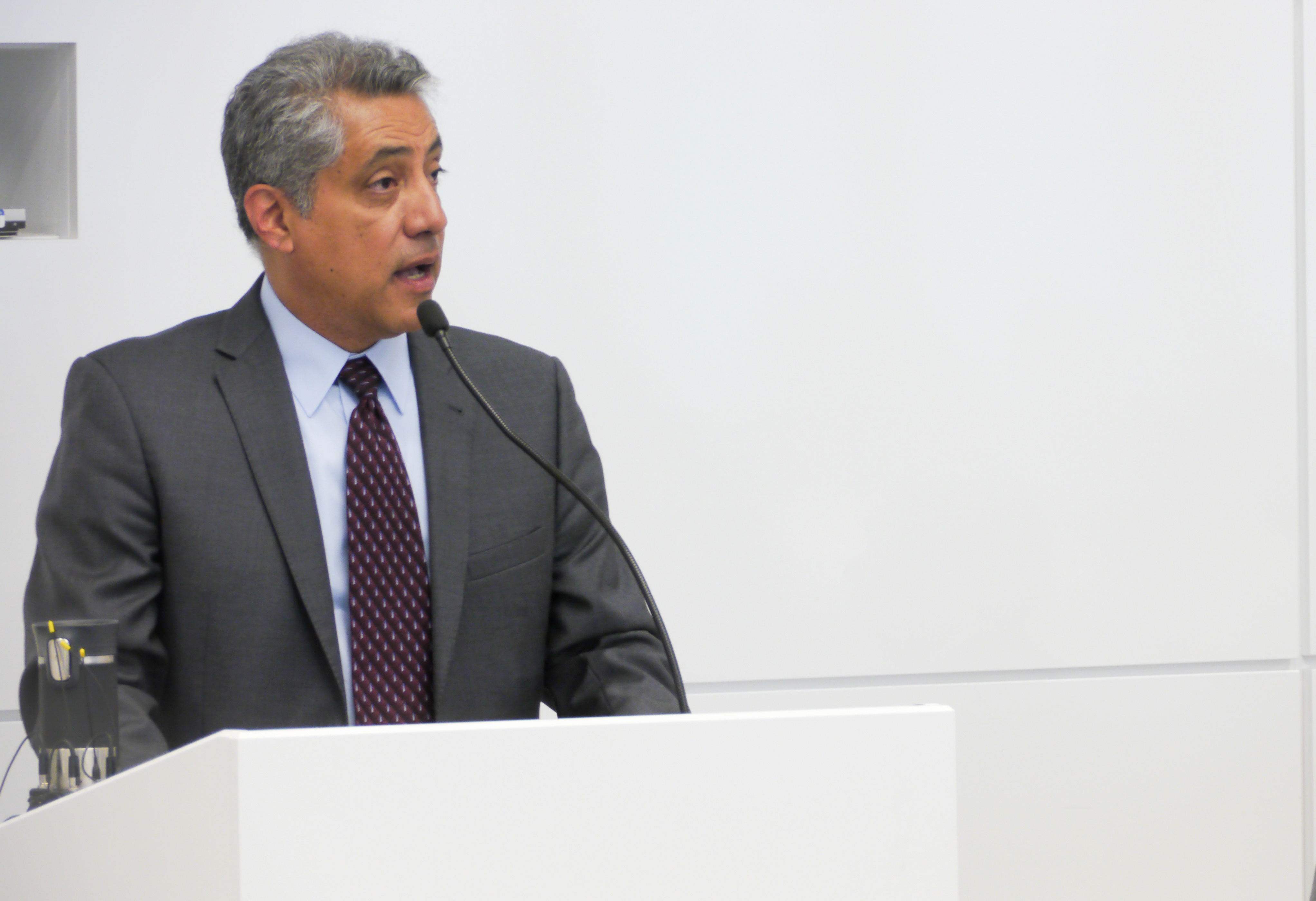 Image of Dr. Padilla speaking at the education forum.
