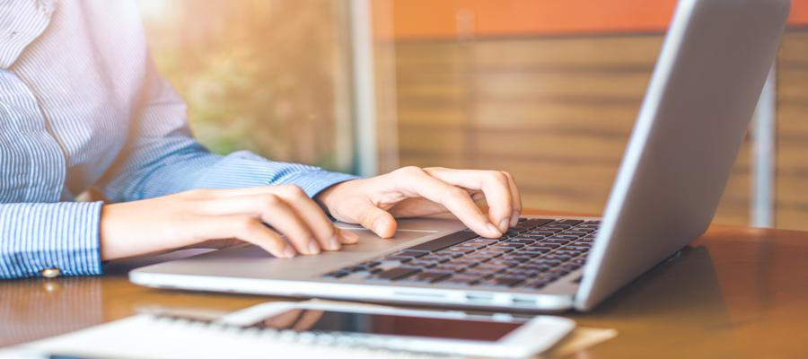 Image of hands typing on a keyboard.
